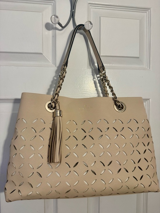 kate spade Handbags - Kate Spade Light Beige Laser-Cut Maryanne Shoulder Bag with Tassel